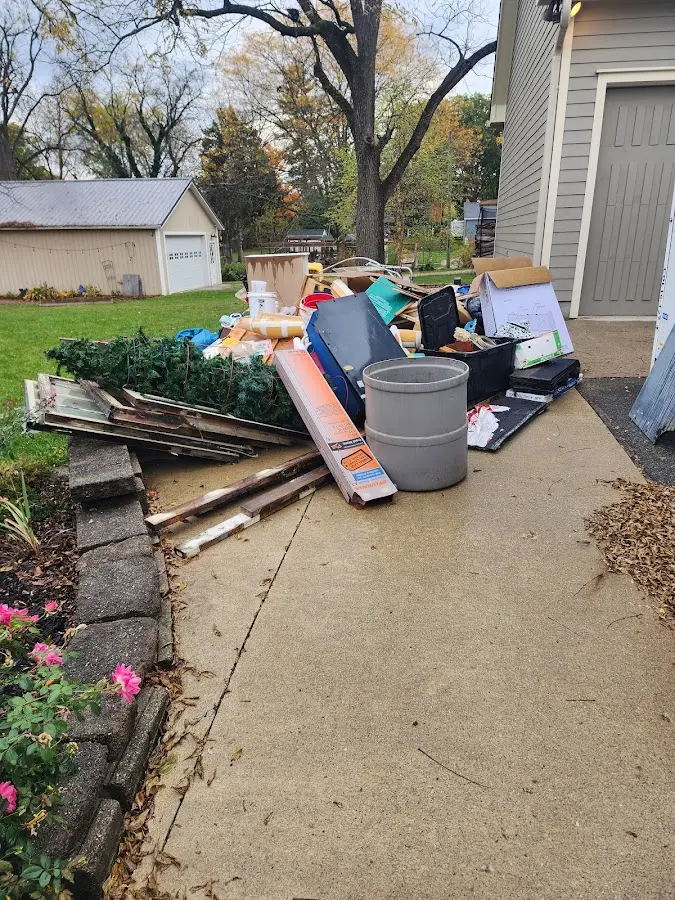Dumpster being loaded with debris for 3 Yard Dumpster Rental in Concord